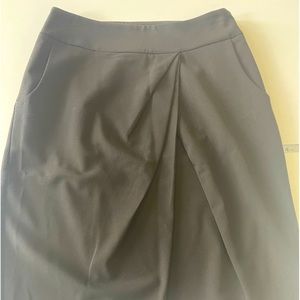 Black pencil skirt with drapery details on front, size 2 fits like 4, excellent